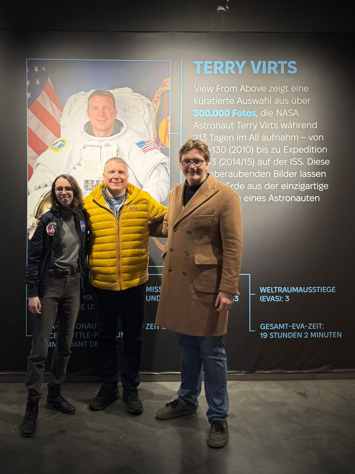 Two members of The New Space Age with former NASA astronaut Terry Virts at the View From Above exhibition in Nuremberg