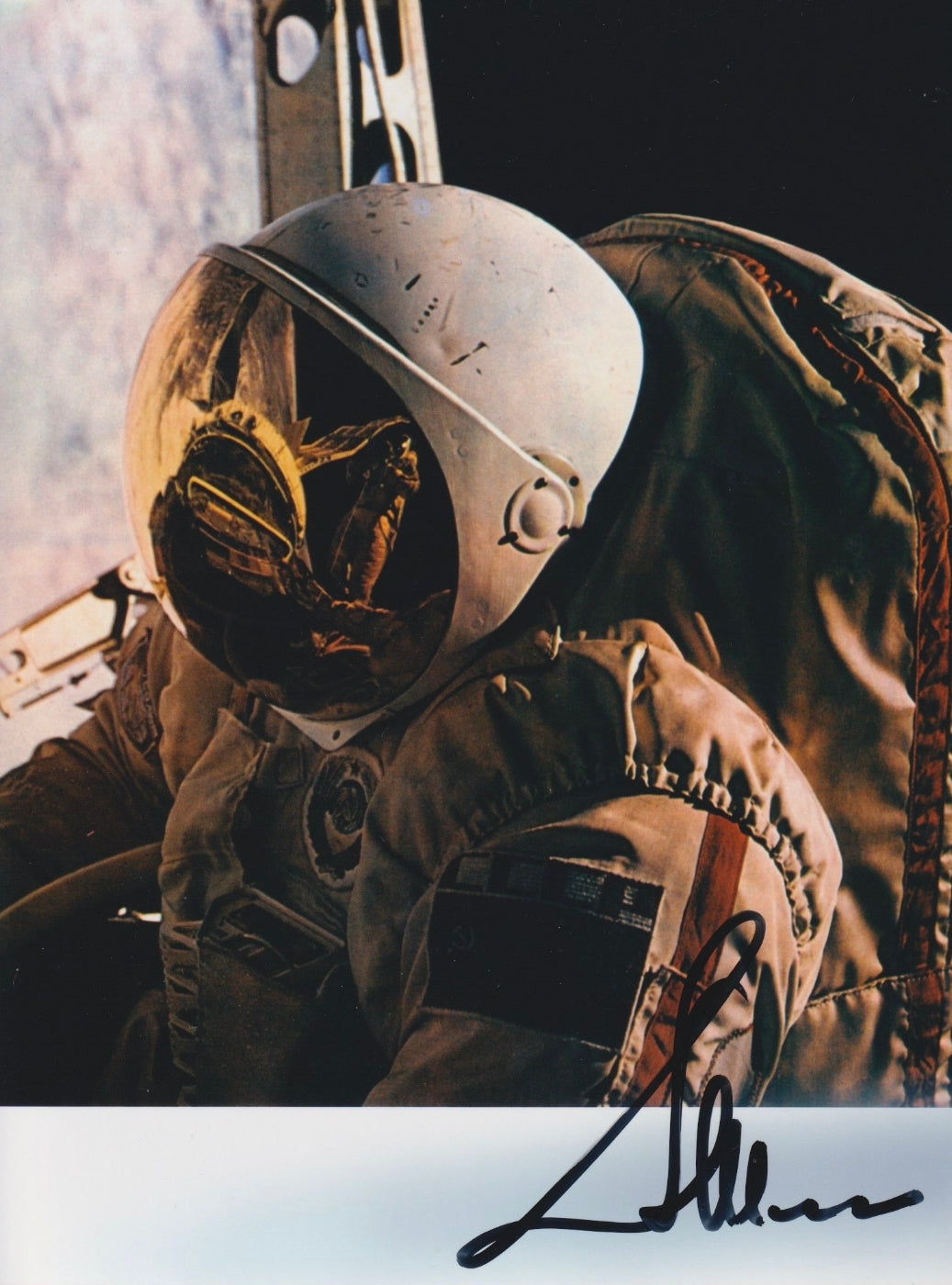 Signed portrait of cosmonaut Aleksandr Ivanchenkov in Orlan EVA spacesuit during spacewalk, ideal for space memorabilia collectors