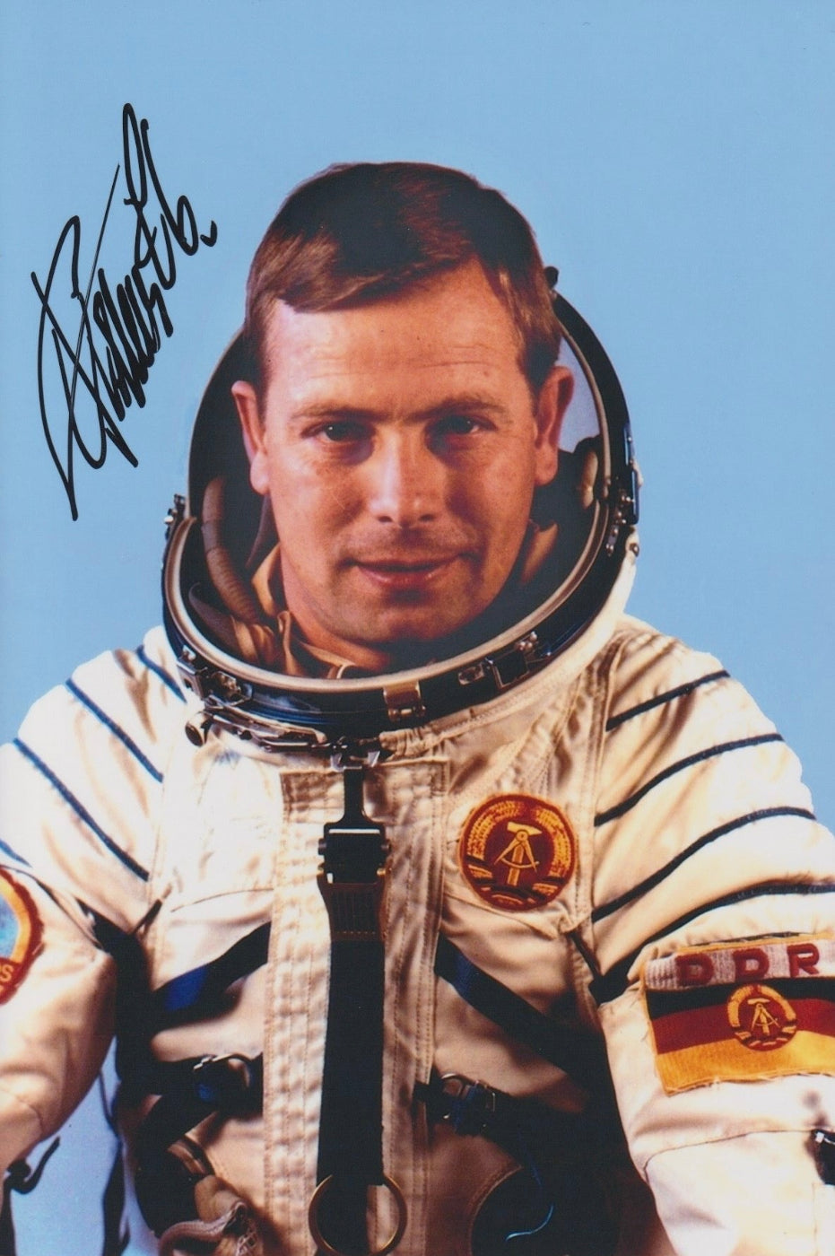 Signed portrait of reserve cosmonaut Eberhard Köllner in Sokol spacesuit with mission patch, perfect for space memorabilia collectors