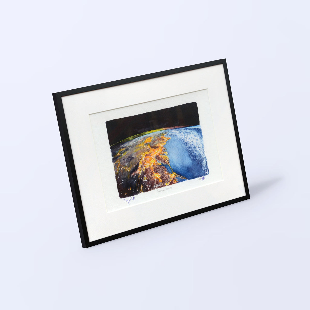 Overview Effect fine art print in a black frame with white mat, shown at an angle on a light background