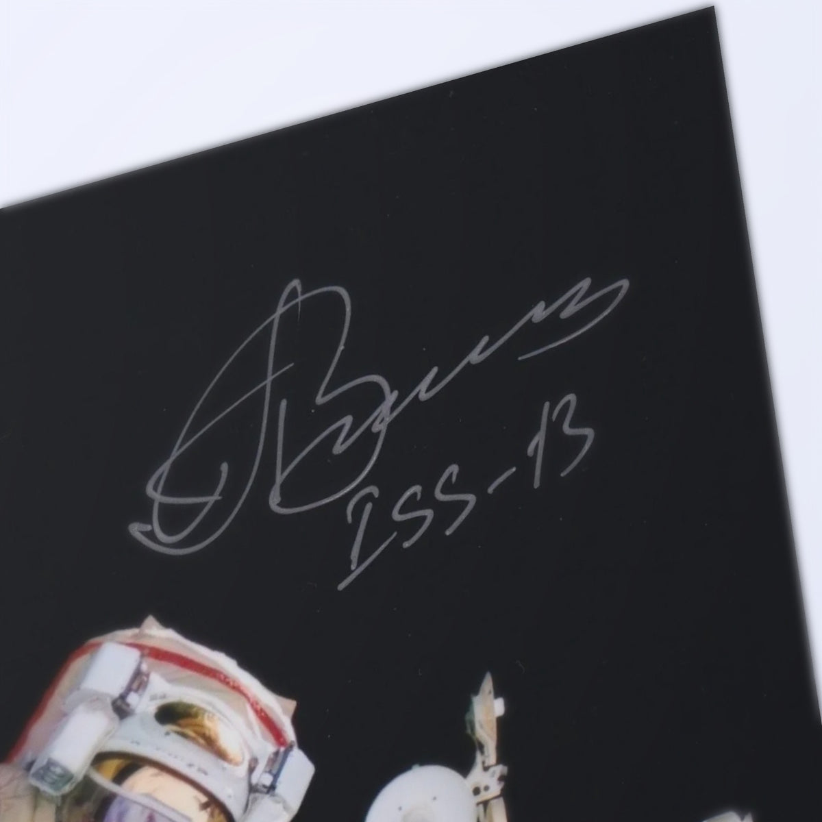 Close-up of Pavel Vinogradov's signature with the ISS-13 inscription