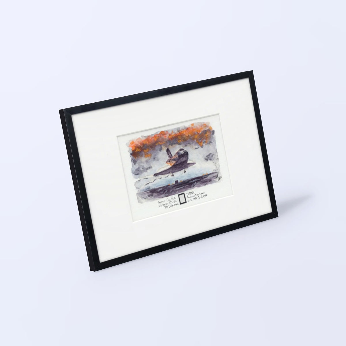 Space Shuttle Discovery landing watercolor print with a flown STS-82 payload bay liner fragment, black frame, angled view