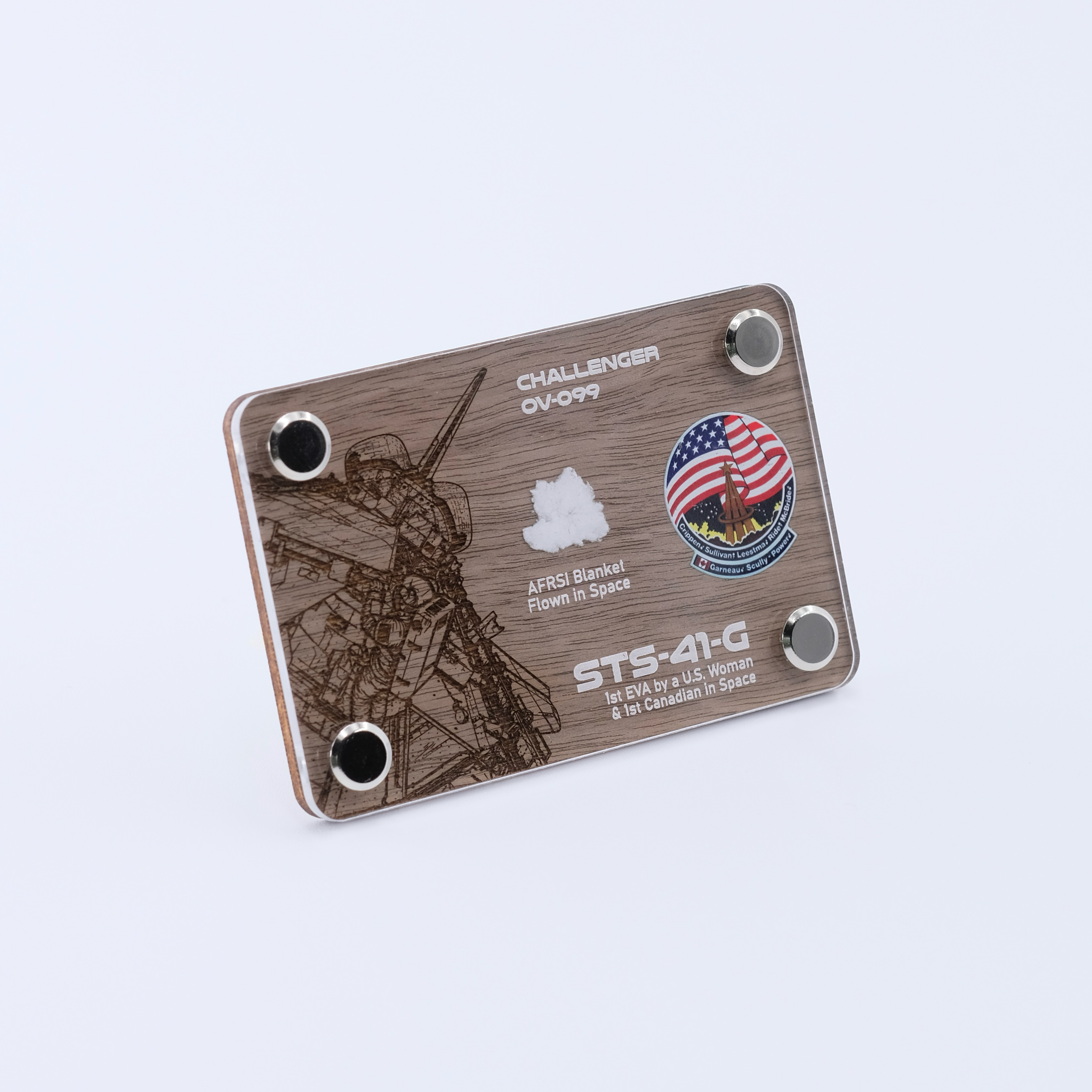 Angled view of an authentic flown AFRSI thermal blanket artifact display card from Space Shuttle Challenger STS-41-G, the mission featuring the first spacewalk by a U.S. woman and the first Canadian in space.