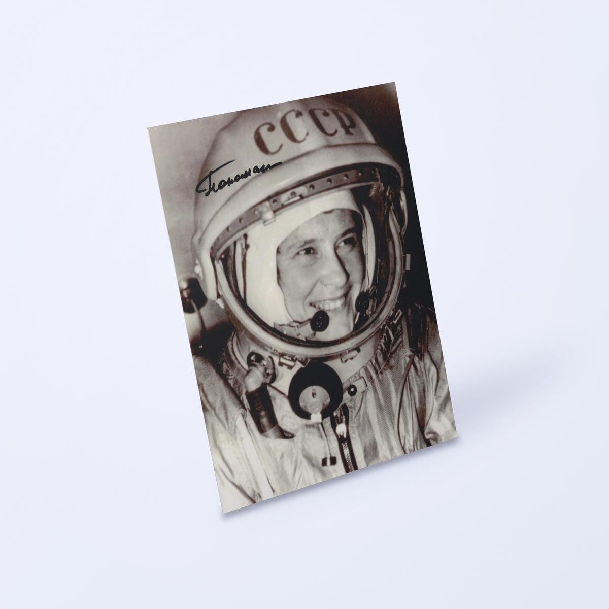 Signed portrait of Soviet cosmonaut candidate Valentina Ponomaryova in a CCCP helmet, shown at an angle on a light background