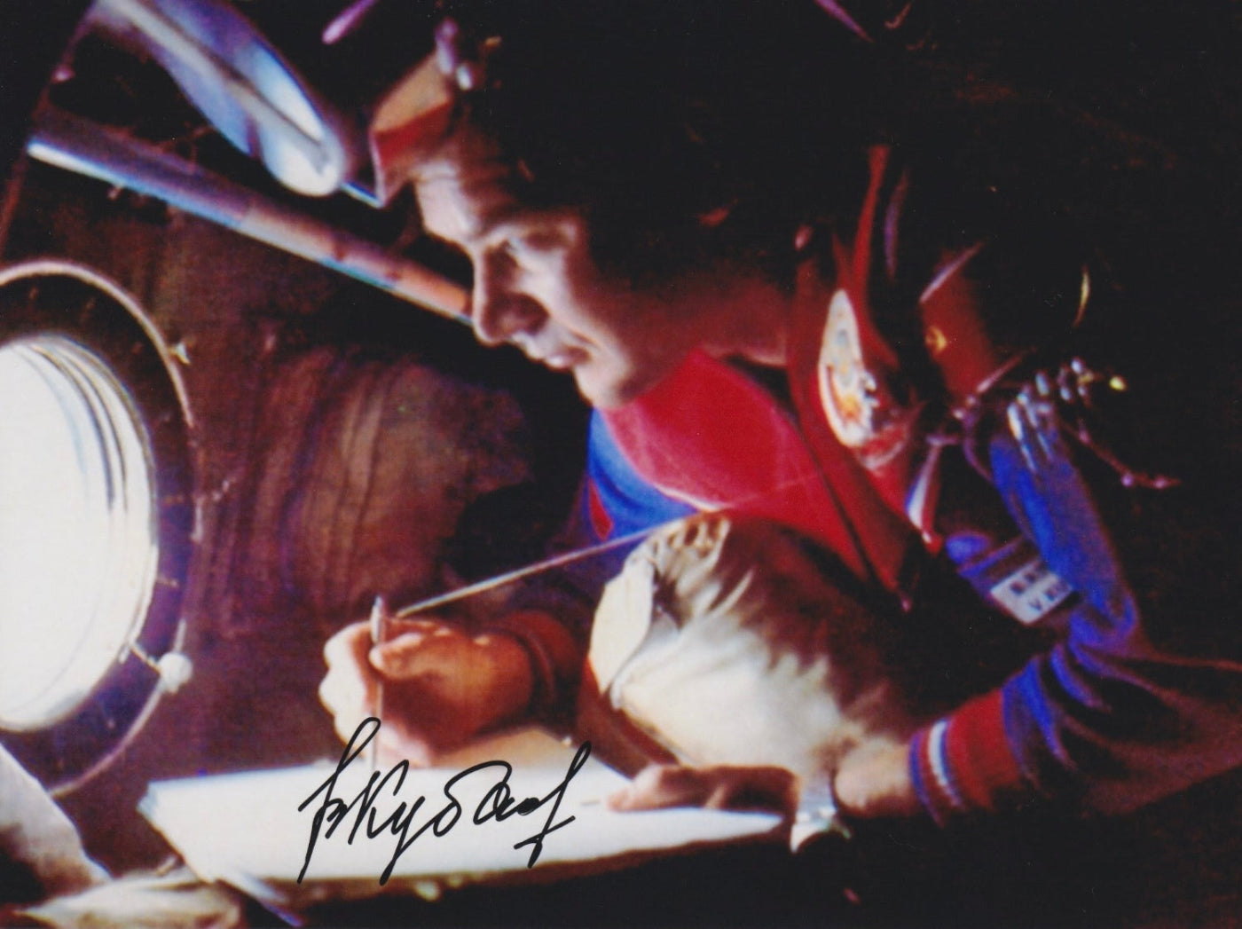 Signed portrait of cosmonaut Valery Kubasov in Sokol spacesuit with mission patch, perfect for space memorabilia collectors