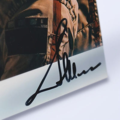Close-up of Aleksandr Ivanchenkov's signature on the photo