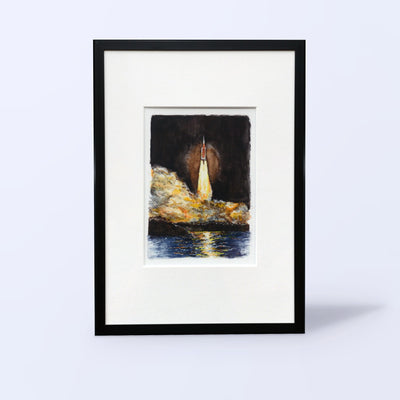 Artemis I watercolor fine art print of the SLS launch in a black frame with white mat, front view