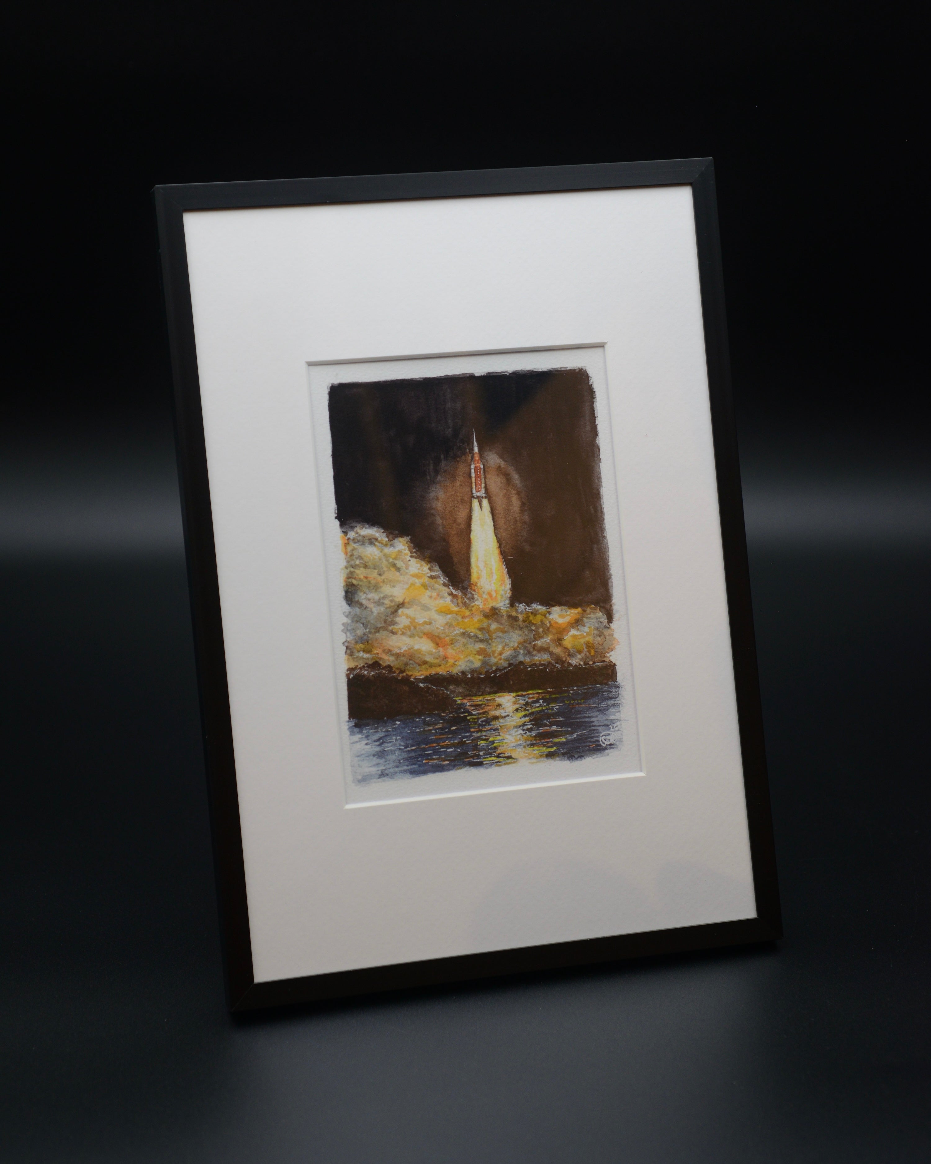 Vibrant watercolor fine art print of the Artemis I launch aboard NASA’s Space Launch System (SLS), created by space artist Sina Rathai. Hand-signed and printed on premium Hahnemühle fine art paper with archival pigment inks, celebrating the first mission of NASA’s Artemis program and Orion’s journey around the Moon. 