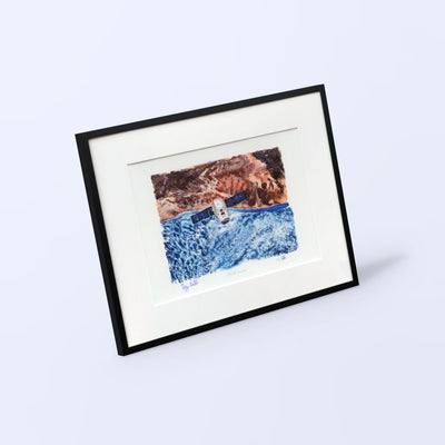Orbital Courier fine art print in a black frame with white mat, shown at an angle on a light background