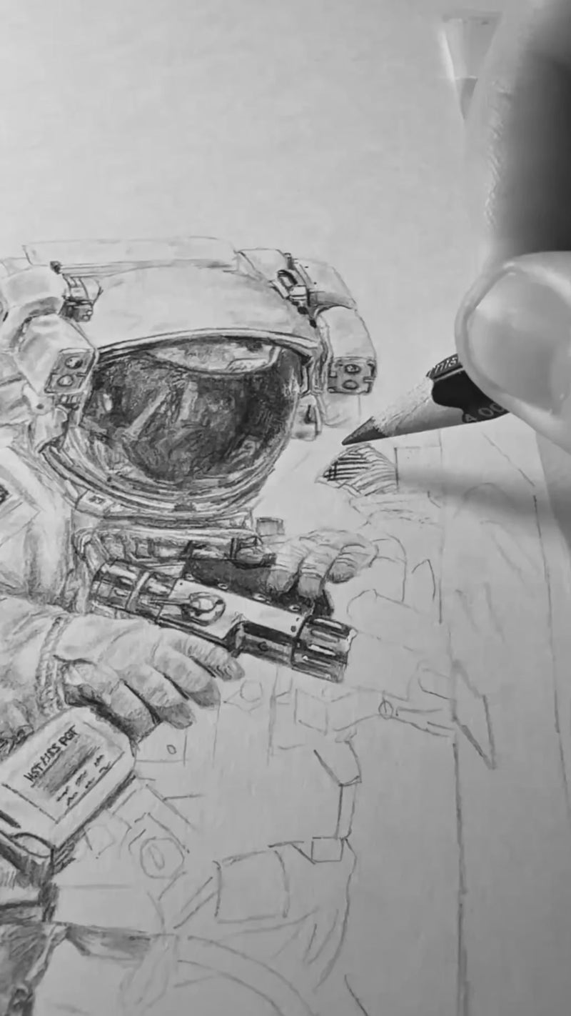 Video thumbnail showing a close-up of a pencil sketch in progress, with an astronaut suit and helmet being drawn by Art of a Space Nerd.