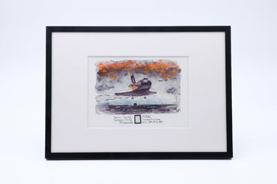 Framed watercolor of Space Shuttle Discovery landing, with a small flown payload bay liner fragment in the print