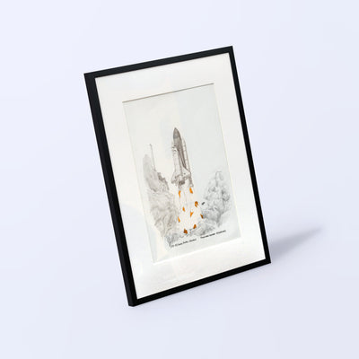 Space Shuttle launch drawing with flown STS-93 solar blanket fragments, black A3 frame with white mat, angled view