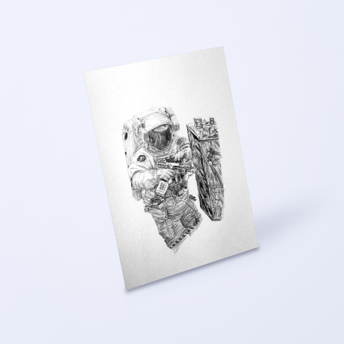 Pencil drawing of an astronaut on a spacewalk as a fine art print, shown at an angle on a light background