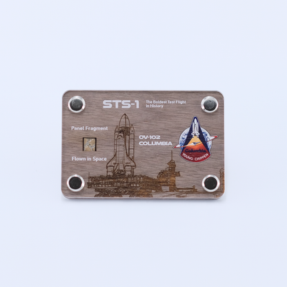 Authentic flown panel fragment from Space Shuttle Columbia STS-1, the first Space Shuttle mission, displayed in a handcrafted collectible artifact card.
