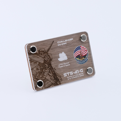 Angled view of an authentic flown AFRSI thermal blanket artifact display card from Space Shuttle Challenger STS-41-G, the mission featuring the first spacewalk by a U.S. woman and the first Canadian in space.