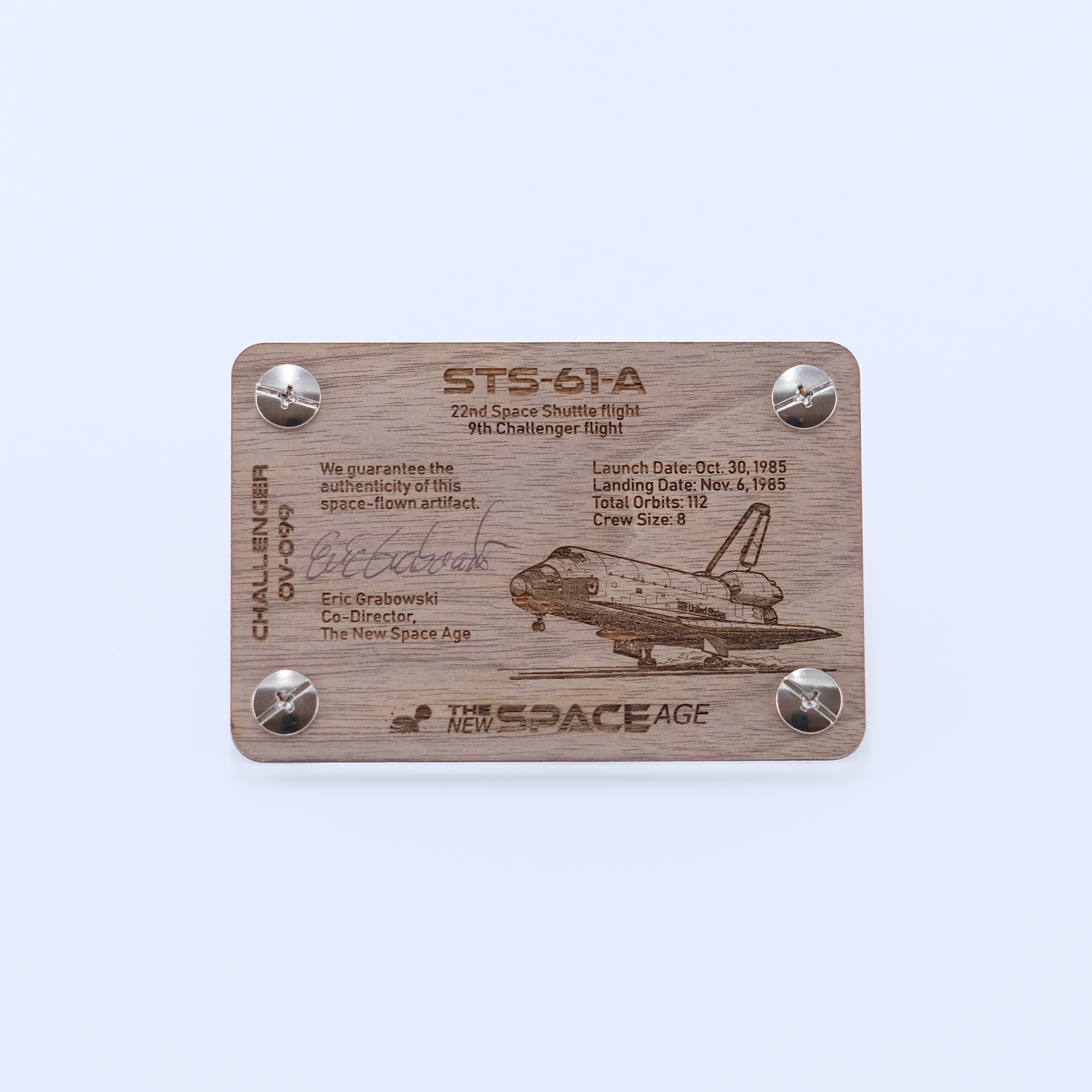 Back side of the STS-61A Challenger flown space fabric artifact display card featuring mission details, authenticity statement, and Space Shuttle Challenger engraving.