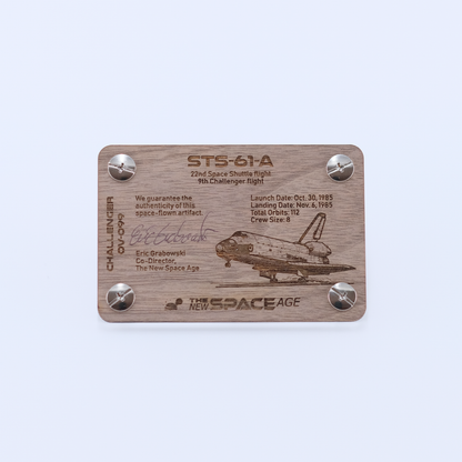 Back side of the STS-61A Challenger flown space fabric artifact display card featuring mission details, authenticity statement, and Space Shuttle Challenger engraving.