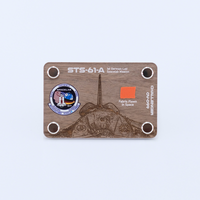 STS-61A Challenger artifact display card featuring a genuine flown space fabric fragment from the first German-led Spacelab mission aboard Space Shuttle Challenger.