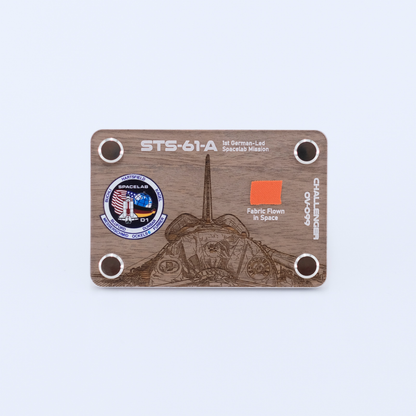 STS-61A Challenger artifact display card featuring a genuine flown space fabric fragment from the first German-led Spacelab mission aboard Space Shuttle Challenger.