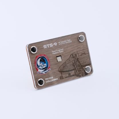 Angled view of an authentic flown panel fragment artifact display card from Space Shuttle Columbia STS-9, the first Spacelab mission and first flight of an ESA astronaut.
