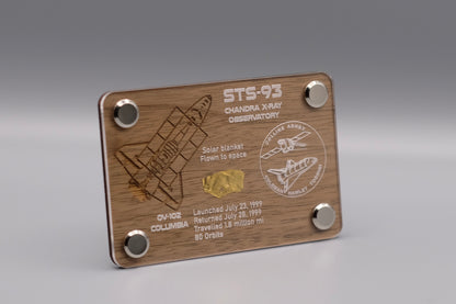 Premium wooden display with flown solar blanket fragment from Space Shuttle Columbia STS-93 mission, featuring engraved mission details and Chandra X-ray Observatory emblem.