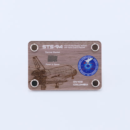 Authentic flown thermal blanket artifact from Space Shuttle Columbia STS-94, the reflight of the Microgravity Science Laboratory mission, displayed in a handcrafted collectible card.