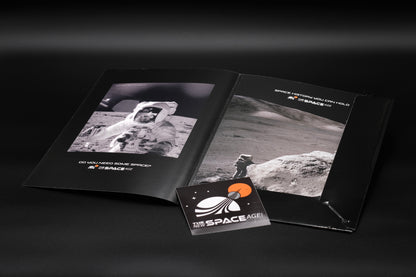 The New Space Age branded folder for fine art prints, showing images from the Apollo space missions and the lunar surface on a dark background together with a logo sticker from The New Space Age.