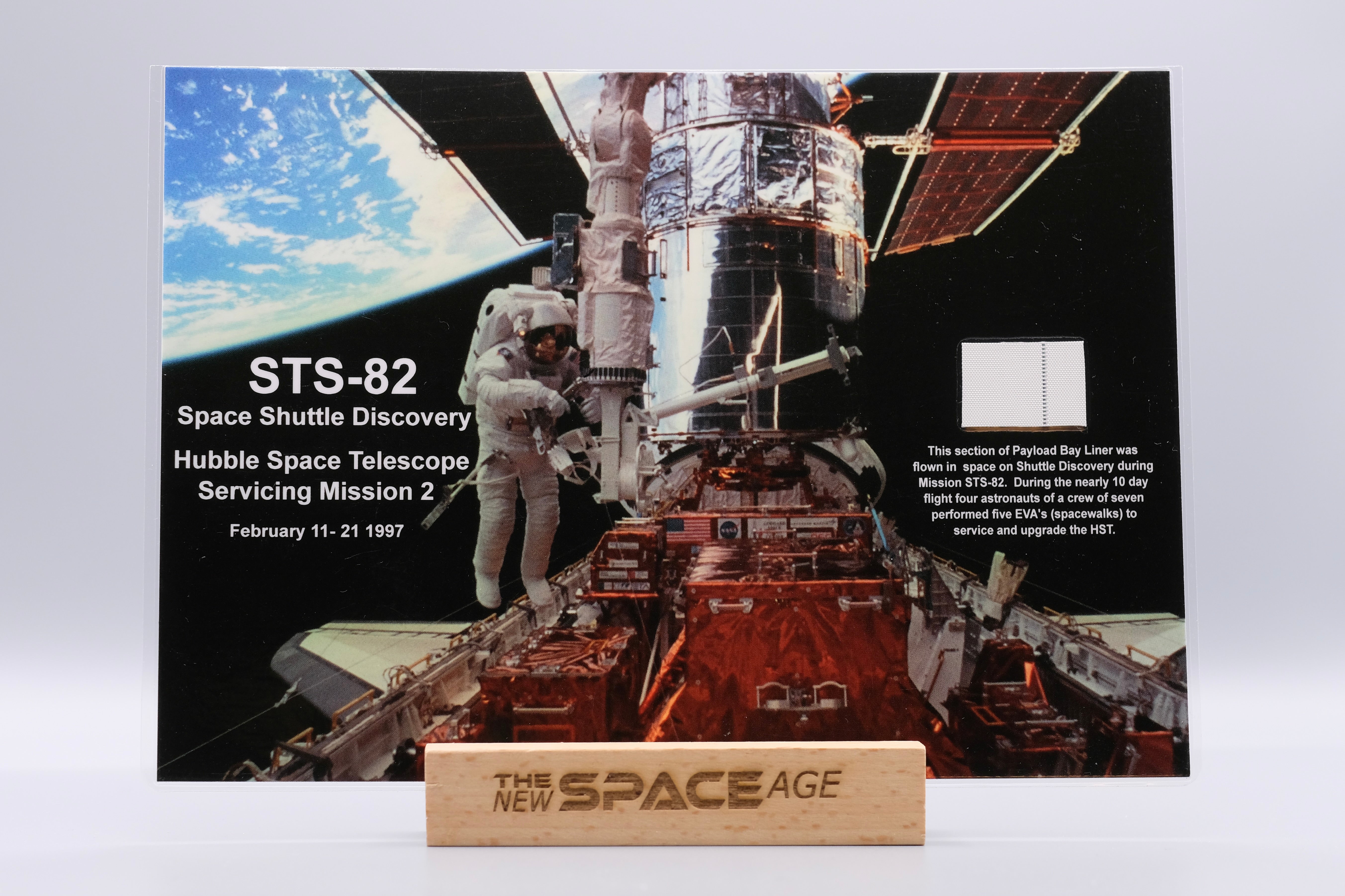 Space Shuttle Discovery STS-82 Hubble Servicing Mission 2 display featuring a flown Payload Bay Liner fragment from February 1997 – authentic space-flown artifact presented by The New Space Age Store.