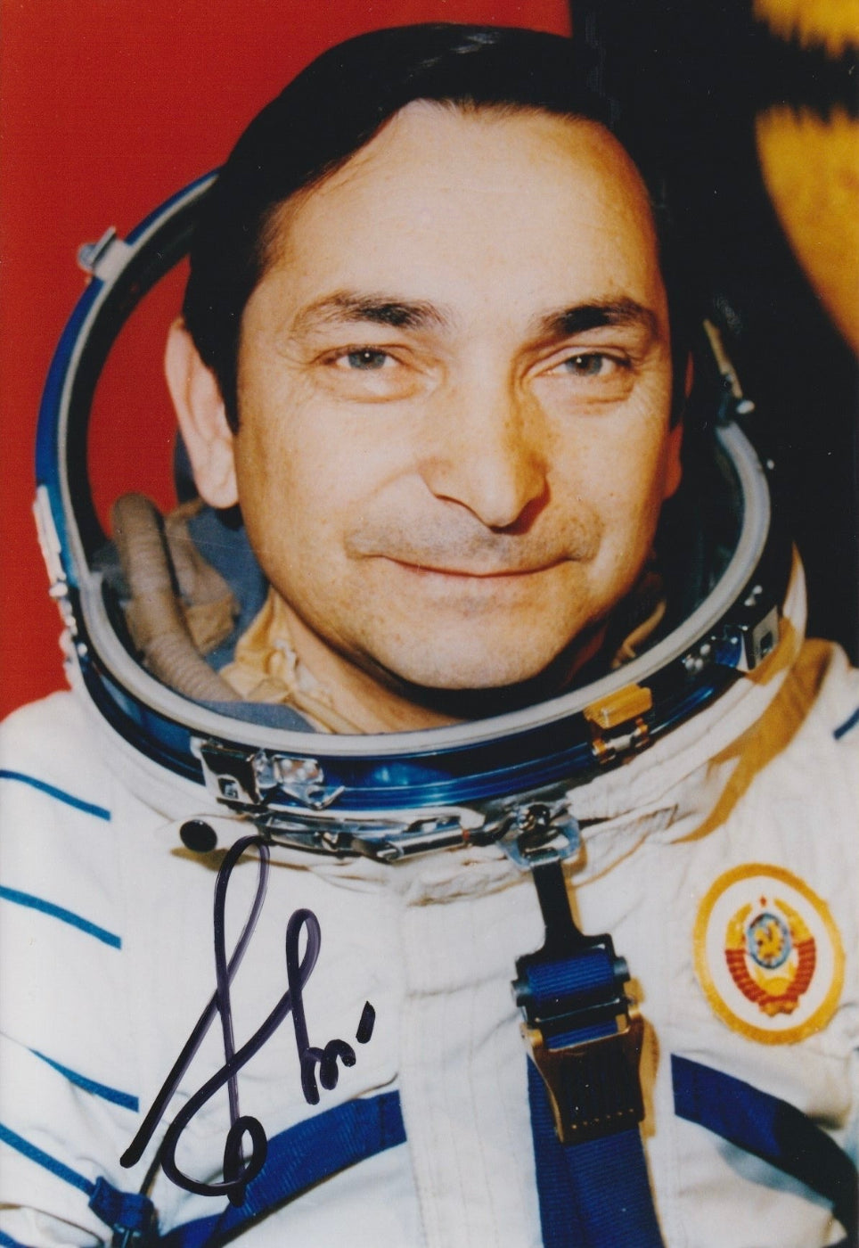 Signed portrait of cosmonaut Valery Bykovsky in Sokol spacesuit with mission patch, perfect for space memorabilia collectors