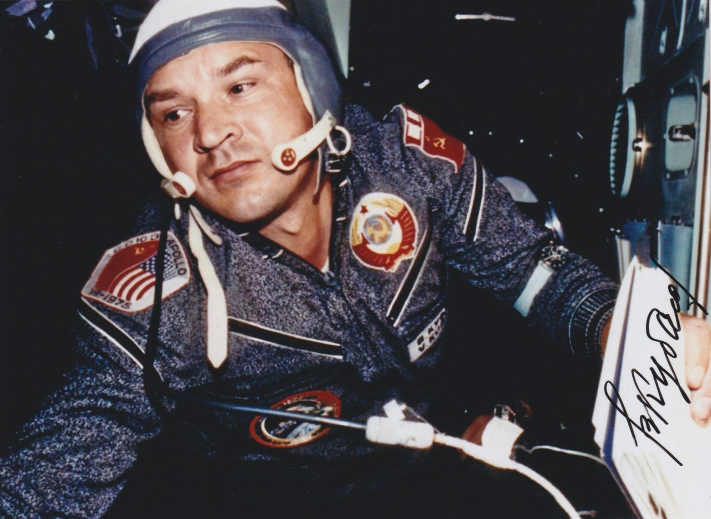 Signed portrait of cosmonaut Valery Kubasov in Sokol spacesuit with mission patch, perfect for space memorabilia collectors