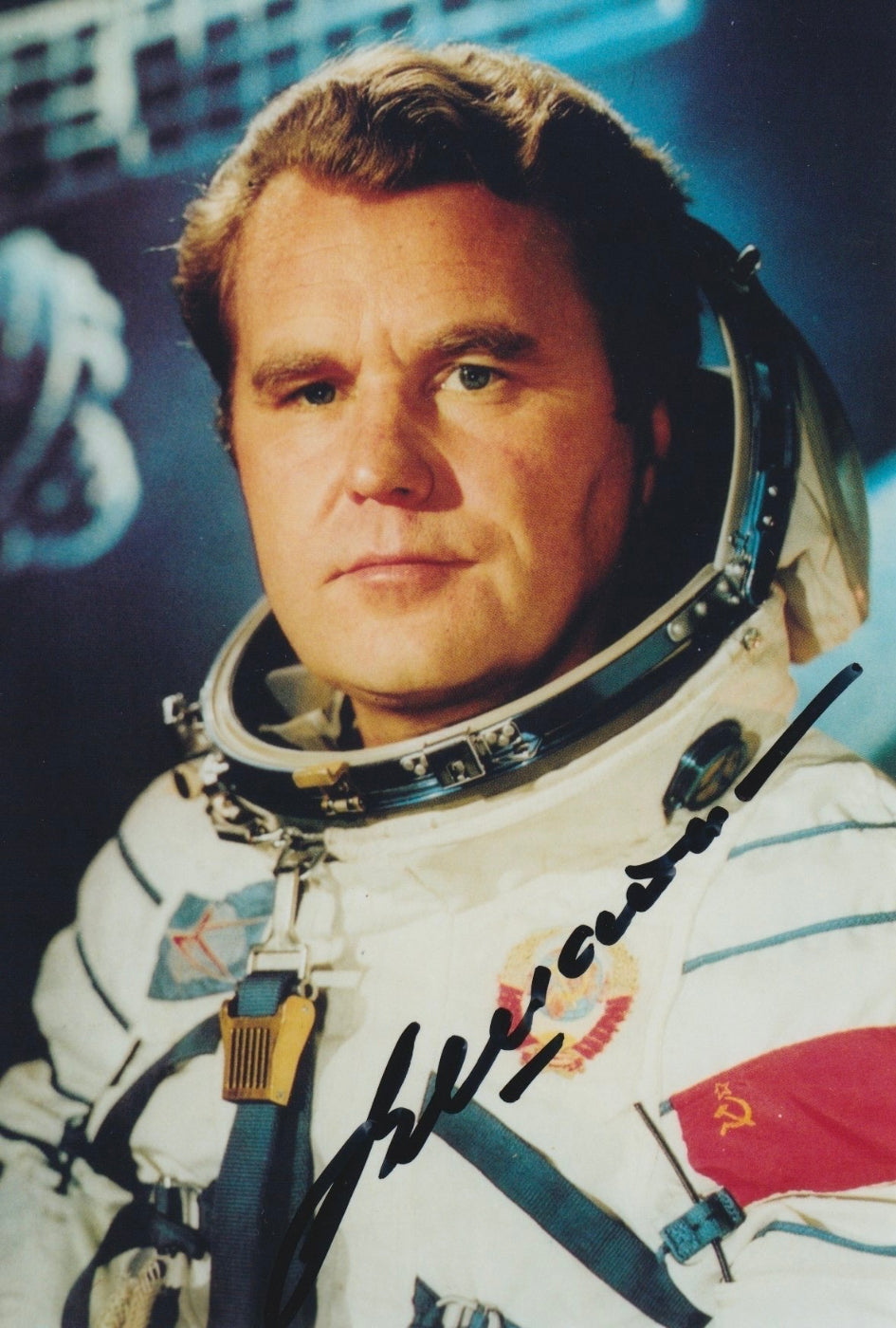Signed portrait of cosmonaut Vladimir Shatalov in Sokol spacesuit with mission patch, perfect for space memorabilia collectors
